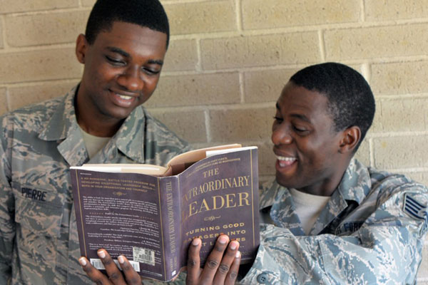 Airmen reading a book